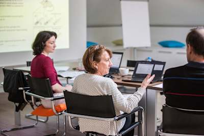 Rosi Lederer talking to colleagues during an annual Wings for Life meeting in Salzburg.