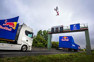 Freestyle motocross star Luc Ackermann launches sky-high above trucks at Red Bull Bridge Traverse in Aldenhoven, Germany, on August 2, 2025.
