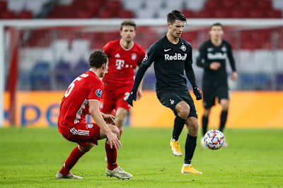 Dominik Szoboszlai takes on Benjamin Pavard during the UEFA Champions League group stage match between FC Bayern Muenchen and Red Bull Salzburg on November 25, 2020.