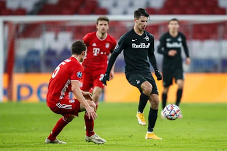 Dominik Szoboszlai takes on Benjamin Pavard during the UEFA Champions League group stage match between FC Bayern Muenchen and Red Bull Salzburg on November 25, 2020.
