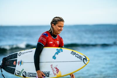 Molly Picklum and her surfboard at Margaret River.