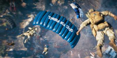 Skydivers with Red Bull-branded parachutes in a scene from Battlefield 6's REDSEC.   