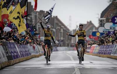 Wout van Aert and his Jumbo-Visma teammate Christophe Laporte as seen at the end of the 2023 Gent-Wevelgem classics race.