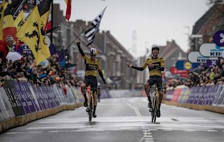 Wout van Aert and his Jumbo-Visma teammate Christophe Laporte as seen at the end of the 2023 Gent-Wevelgem classics race.