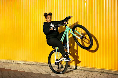 Bike Life rider Curly pops a wheelie.