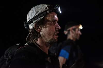 Ryan Sandes runs through the night with a head torch