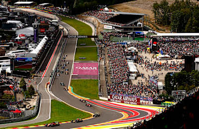 Charles Leclerc leads Sergio Perez and the rest of the field at the start during the F1 Grand Prix of Belgium at Circuit de Spa-Francorchamps on July 30, 2023 in Spa, Belgium.