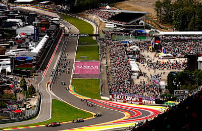 Charles Leclerc leads Sergio Perez and the rest of the field at the start during the F1 Grand Prix of Belgium at Circuit de Spa-Francorchamps on July 30, 2023 in Spa, Belgium.