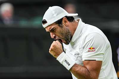 Matteo Berrettini celebrates winning a point during the Men's Singles Second Round match against Jannik Sinner at Wimbledon in 2024. 