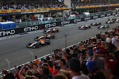 Max Verstappen leads the field into turn one at the start during the F1 Grand Prix of Abu Dhabi at Yas Marina Circuit on December 07, 2025.