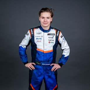 In 2025, Mille Johansson poses in rally racing gear at the World Rally Championship event in Umea, Sweden