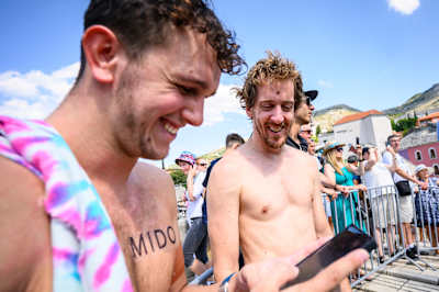 Aidan Heslop and Gary Hunt share a light moment in Mostar before their dives during the Red Bull Cliff Diving World Series 2023 fifth stop at Stari Most
