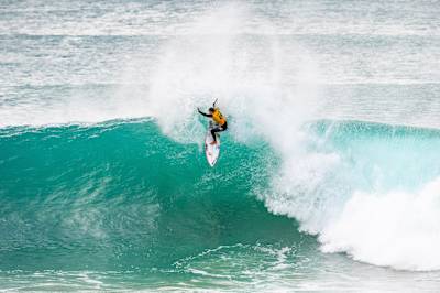 Australian surfer Molly Picklum rides a powerful wave during Heat 3 of the Quarterfinals at the 2025 Red Bull-backed Corona Cero Open J-Bay in Jeffreys Bay, South Africa