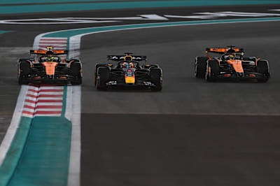 Max Verstappen leads Lando Norris and Oscar Piastri during the F1 Grand Prix of Abu Dhabi at Yas Marina Circuit on December 07, 2025 in Abu Dhabi, United Arab Emirates.