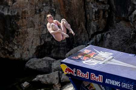 Molly Carlson of Canada dives from the 21 metre platform during the first stop of the 2024 Red Bull Cliff Diving World Series at Lake Vouliagmeni in Athens, Greece on May 26, 2024.