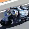 Álex Márquez races in Valencia at the 2025 MotoGP testing, sporting a dynamic Red Bull helmet and Ducati bike at Circuit Ricardo Tormo