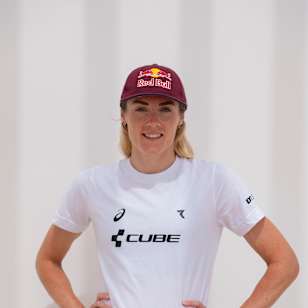 Lucy Charles-Barclay stands confidently in Red Bull gear at Club La Santa, Lanzarote, during the 2024 season, embodying the adventurous Red Bull spirit in triathlon training.