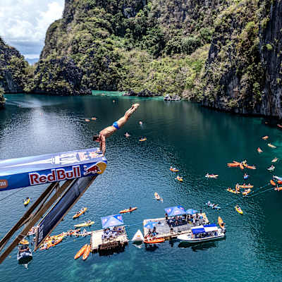 Romanian diver Constantin Popovici drops into the Big Lagoon from 27 metres on Day 3