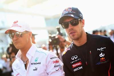 Michael Schumacher und Sebastian Vettel beim F1 Grand Prix von Abu Dhabi, 2014. 