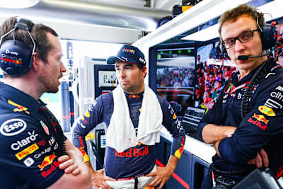 Sergio Pérez of Oracle Red Bull Racing talks with his engineers in the garage prior to the F1 Grand Prix of Brazil at Autodromo Jose Carlos Pace on November 13, 2022 in Sao Paulo, Brazil.