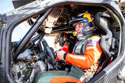 Sébastien Loeb in his Red Bull rally car at the 2025 Dakar Rally start line in Saudi Arabia.