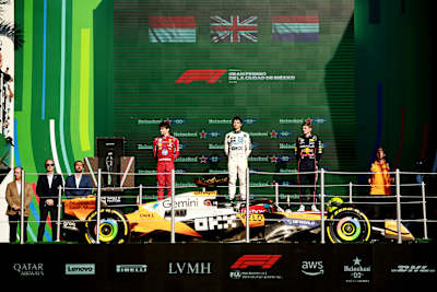 F1 drivers Charles Leclerc, Lando Norris and Max Verstappen on the podium at the Mexican Grand Prix 