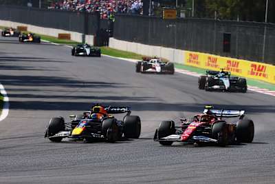 Max Verstappen in a duel with Lewis Hamilton at the 2025 Mexican Grand Prix.