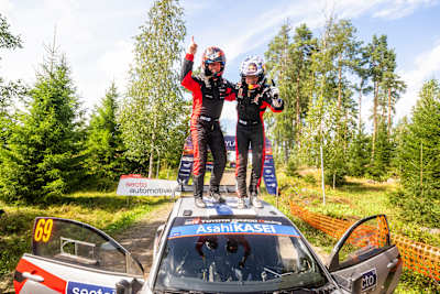 Kalle Rovanperä (FIN) Jonne Halttunen (FIN) Of Toyota Gazoo Racing Wrt celebrate on the podium in first place after winning the World Rally Championship in Jyvasküla, Finland on 3.08.2025