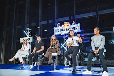 The judges engage in discussions prior to the Red Bull Basement World Final in Tokyo, Japan on December 5, 2024, embodying the innovative and creative spirit of Red Bull