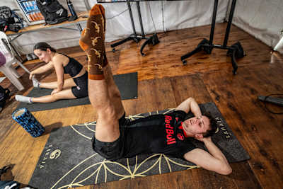 Aidan Heslop and Simone Leathead warm up at the 2024 Red Bull Cliff Diving finale in Sydney, showcasing their focus and energy before the final competition