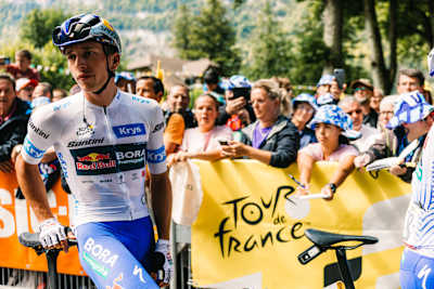Florian Lipowitz on the 20th stage of the Tour de France 2025 as he gets into position at the start in front of the enthusiastic fans on the route from Nantua to Pontarlier