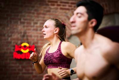 HYROX athletes power through a run at the gym 