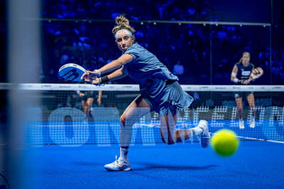 Beatriz González dives for a winning shot during the Premier Padel 2025 Finals semifinals in Barcelona, Spain, showcasing Red Bull's thrilling energy on court.