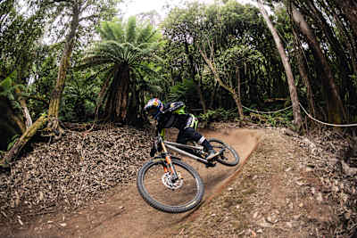 Aaron Gwin carves a daring turn during Red Bull Hardline practice in Maydena Bike Park, Australia, February 2026.