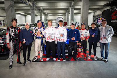 Hiroya Minowa, Ayumu Iwasa, Mad Mike, Liam Lawson, Arvid Lindblad, Yuki Tsunoda, Katsuta Takamoto, Tomoki Nojiri, Ukyo Sasahara pose for a photo at the Red Bull Tokyo Drift in Japan on March 21, 2026