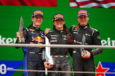 Race winner Emma Felbermayr, second-placed Alisha Palmowski and third-placed Payton Westcott on the 2026 F1 Academy podium during in Shanghai, China. (Photo by Sona Maleterova/Getty Images)