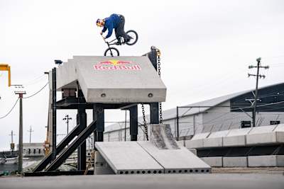 In Cape Town, South Africa, 2026, Murray Loubser showcases daring BMX skills atop the Red Bull Cape Concrete Social First Project ramp, elevating urban street riding to new heights