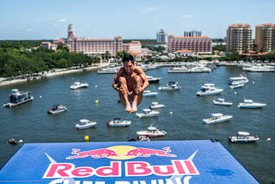 Sergio Guzman of Mexico soars from the 27 metre platform at Red Bull Cliff Diving World Series in St. Petersburg, United States, with boats and spectators watching in June 2026