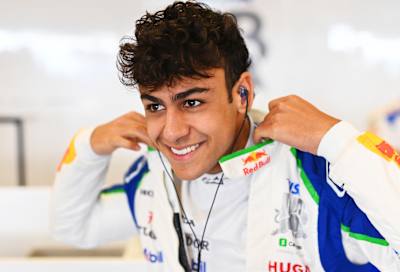 Arvid Lindblad of Great Britain and Visa Cash App Racing Bulls prepares to drive in the garage during F1 Testing at Yas Marina Circuit on December 09, 2025 in Abu Dhabi, United Arab Emirates. 