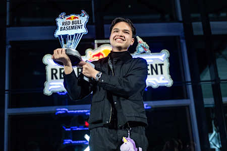 Soj Gamayon of the Philippines smiles upon receiving the winner's trophy for his AgriConnect idea at the Red Bull Basement World Final in Tokyo, Japan in December 2024.