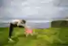 Gary Hunt stretching on a cliffside.