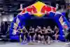 A group of female athletes run through an inflatable Red Bull arch at the HYROX Major in Hong Kong in November 2024.