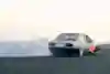 In 2024, David Coulthard and Samkeliso Thubane drift Red Bull Racing cars at Kyalami circuit in Johannesburg, South Africa, leaving trails of smoke behind them.