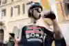 Laurence Pithie of Red Bull BORA-hansgrohe hydrates during Milano-Sanremo in San Remo, Italy, March 2025, showcasing endurance and performance on the legendary cycling stage.