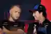 Kevin Magnussen and Sergio Perez in conversation before the 2024 F1 Australian Grand Prix.