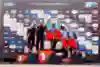 Ott Tänak and Martin Järveoja of Hyundai Shell Mobis World Rally Team celebrate first place at the 2025 FIA World Rally Championship podium in Lamia, Greece, alongside WRC's top teams