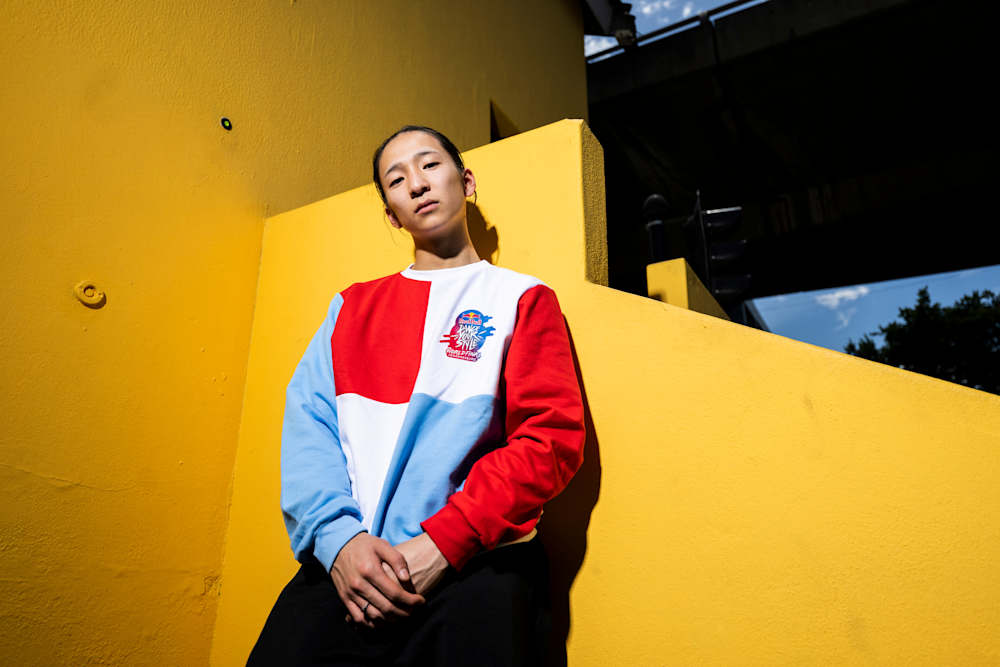 A portrait of THE D Soraki wearing Red Bull Dance Your Style clothing.