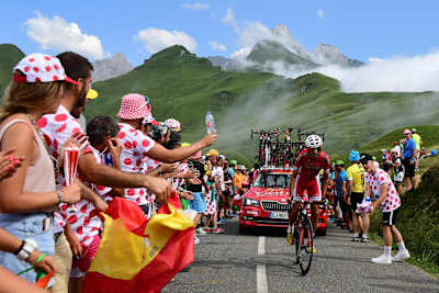 Passionate crowds cheer on riders at the Tour de France. 