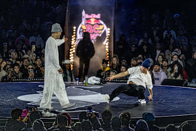 Issin (right) of Japan competes against Phil Wizard of Canada during the Red Bull BC One World Final at Court Philippe-Chatrier, Roland Garros, Paris, France, on October 21, 2023.