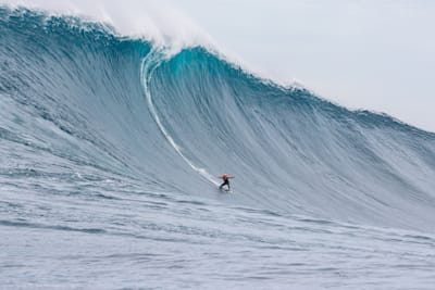 Justine Dupont riding a huge wave at Cortes Bank, off the coast of California, USA.